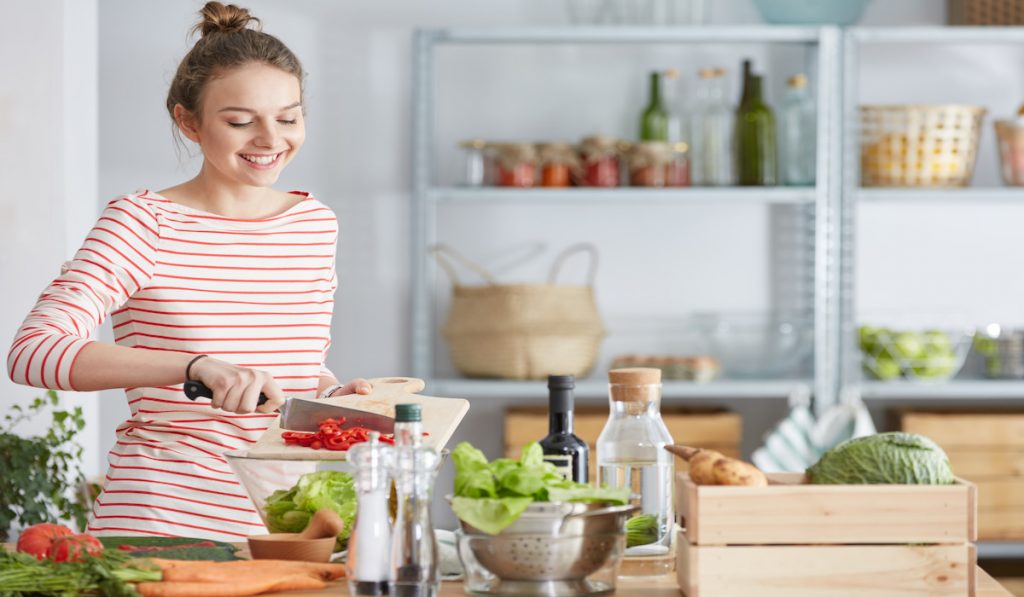 happy woman preparing meal prep