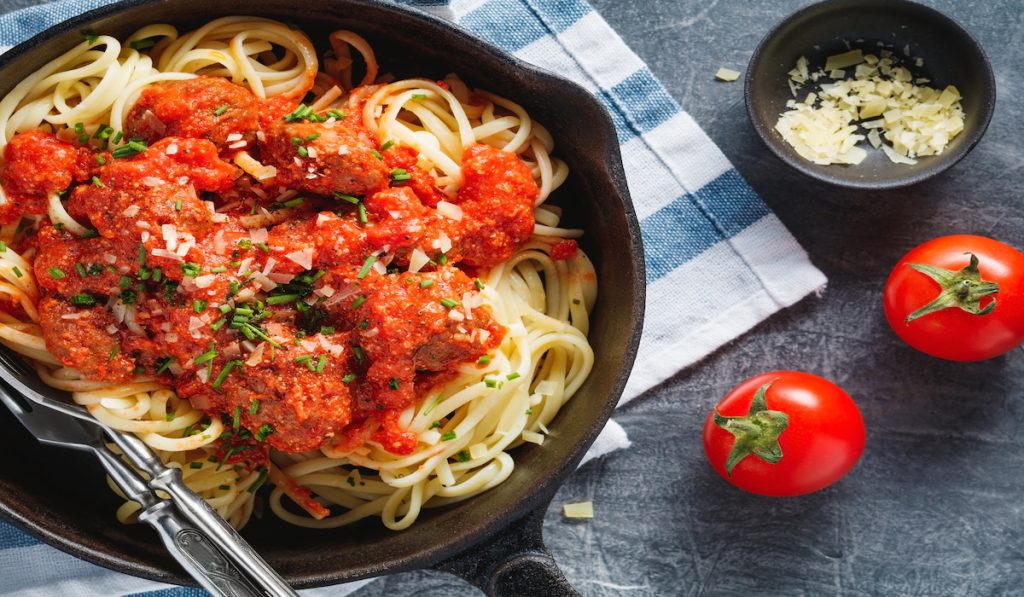 spaghetti with meatballs on a pan 