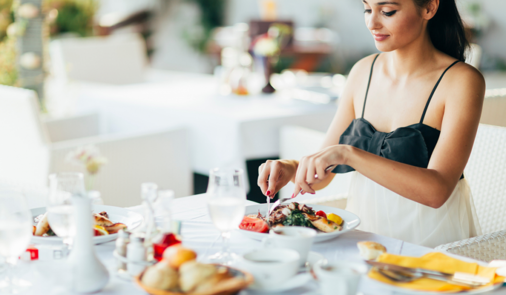 Beautiful woman eating meal