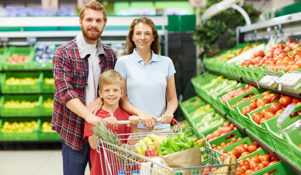 Family in grocery store buying fresh produce