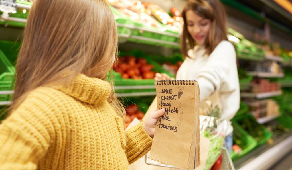 little girl helping mom in grocery