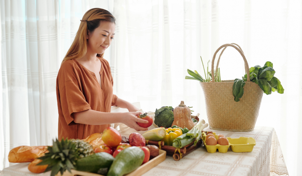 Woman unpacking bags of groceries
