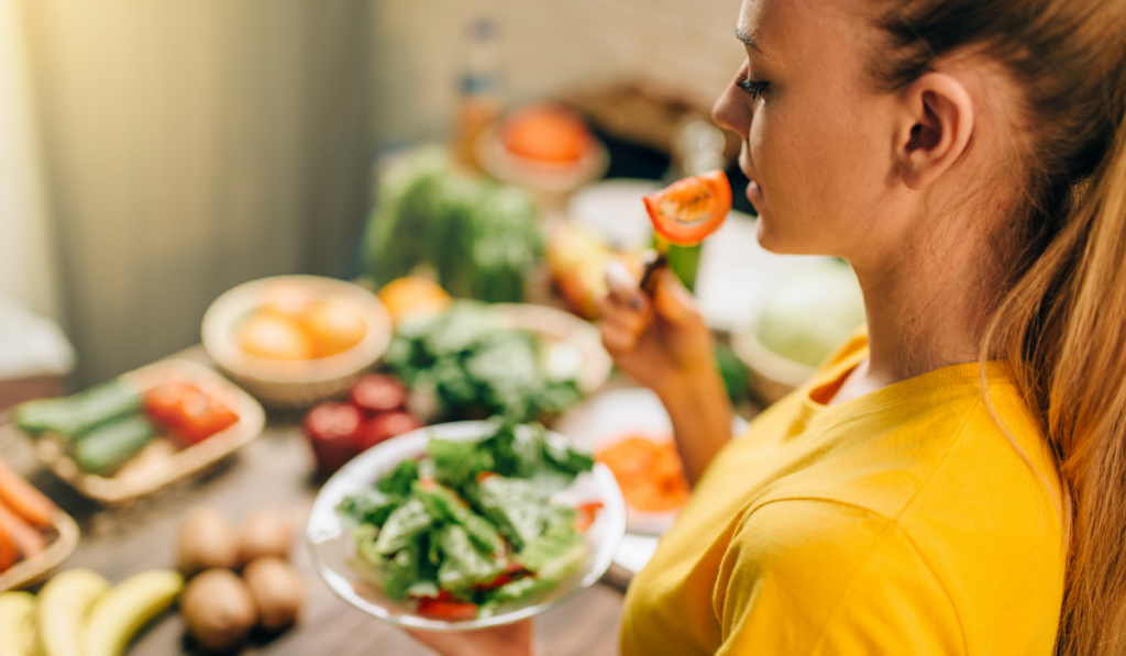 Young woman eating healthy eco food
