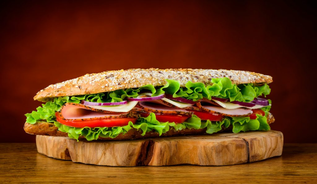 big sandwich with ham, tomatoes, lettuce