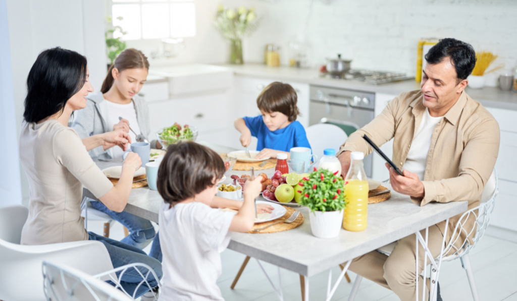 family of 5 enjoying a healthy meal together