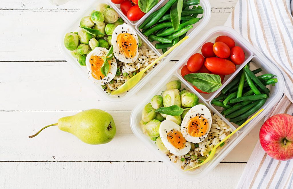 vegetarian meal prep containers with eggs and brussel